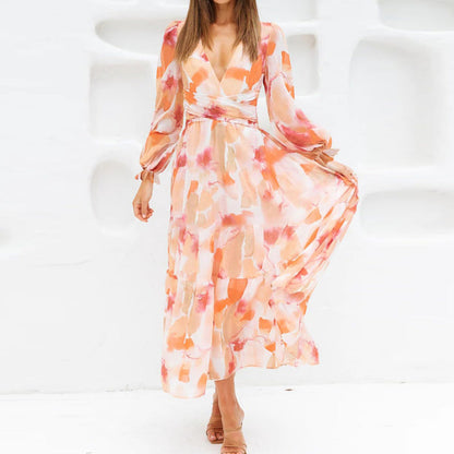 Vestido midi floral con vuelo romántico y escote cruzado – AMARELLA