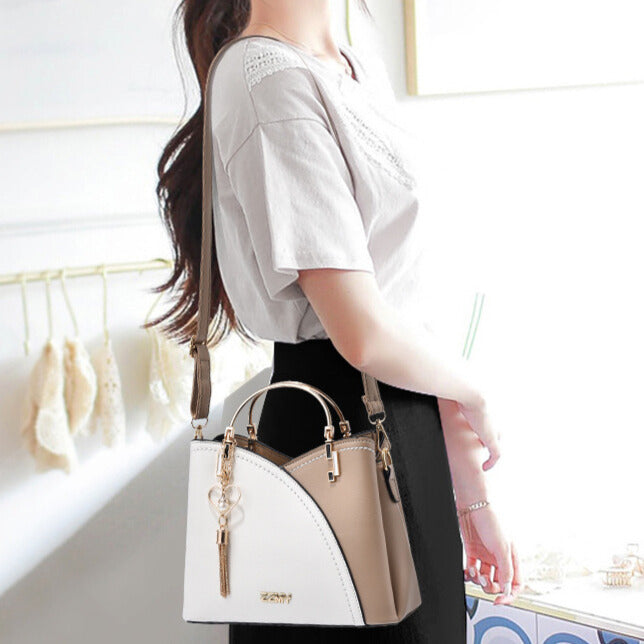 Bolso de mano lujoso con acabado elegante y correa ajustable – LOREVIA