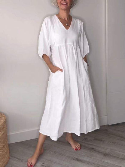 Vestido midi con escote en V, bolsillos y corte fluido – LUCIE