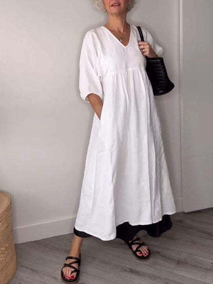 Vestido midi con escote en V, bolsillos y corte fluido – LUCIE