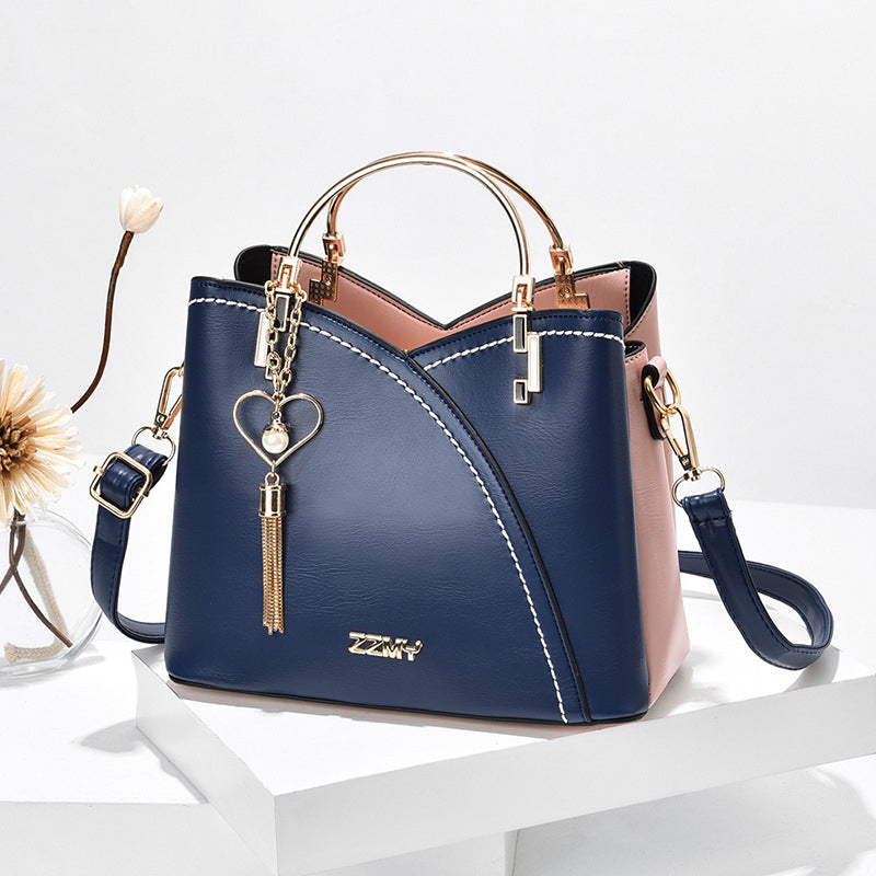 Bolso de mano lujoso con acabado elegante y correa ajustable – LOREVIA